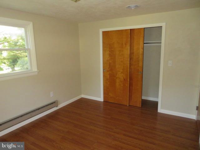 1240 Hoff Road Hanover, PA 17331 - Photo 24 of 51 an empty room with wooden floor and windows