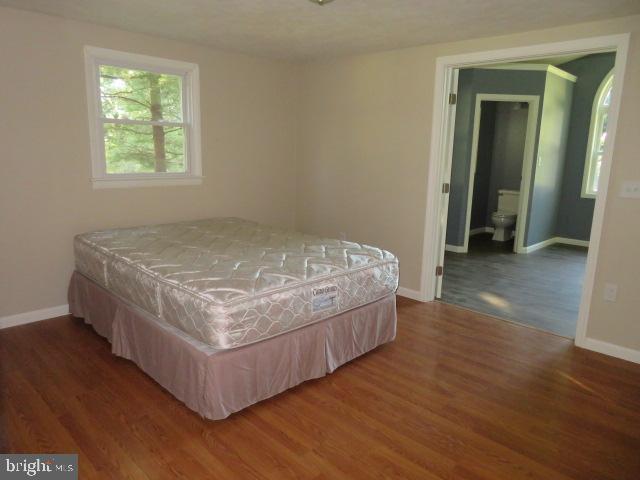 1240 Hoff Road Hanover, PA 17331 - Photo 25 of 51 a bed sitting in a spacious bedroom next to a window