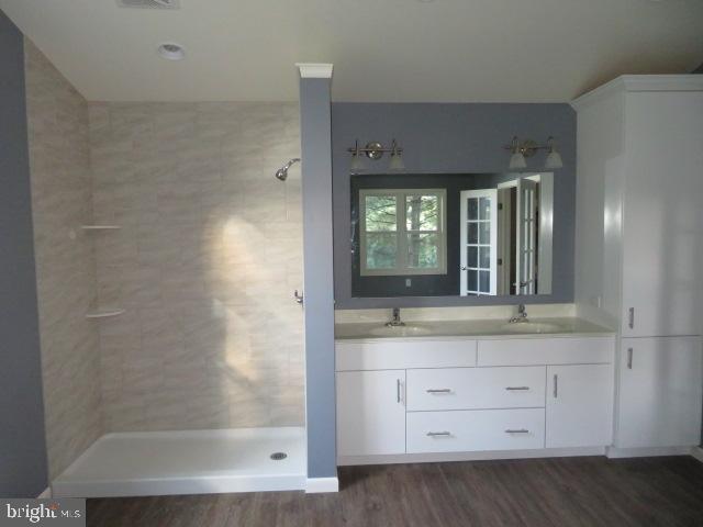 1240 Hoff Road Hanover, PA 17331 - Photo 35 of 51 a bathroom with a granite countertop sink a mirror and a shower