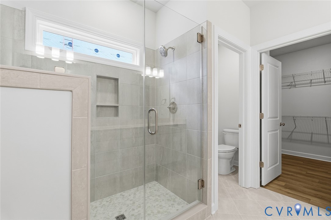 19018 Palisades Ridge Moseley, VA 23120 - Photo 13 of 37 a bathroom with a shower and a sink
