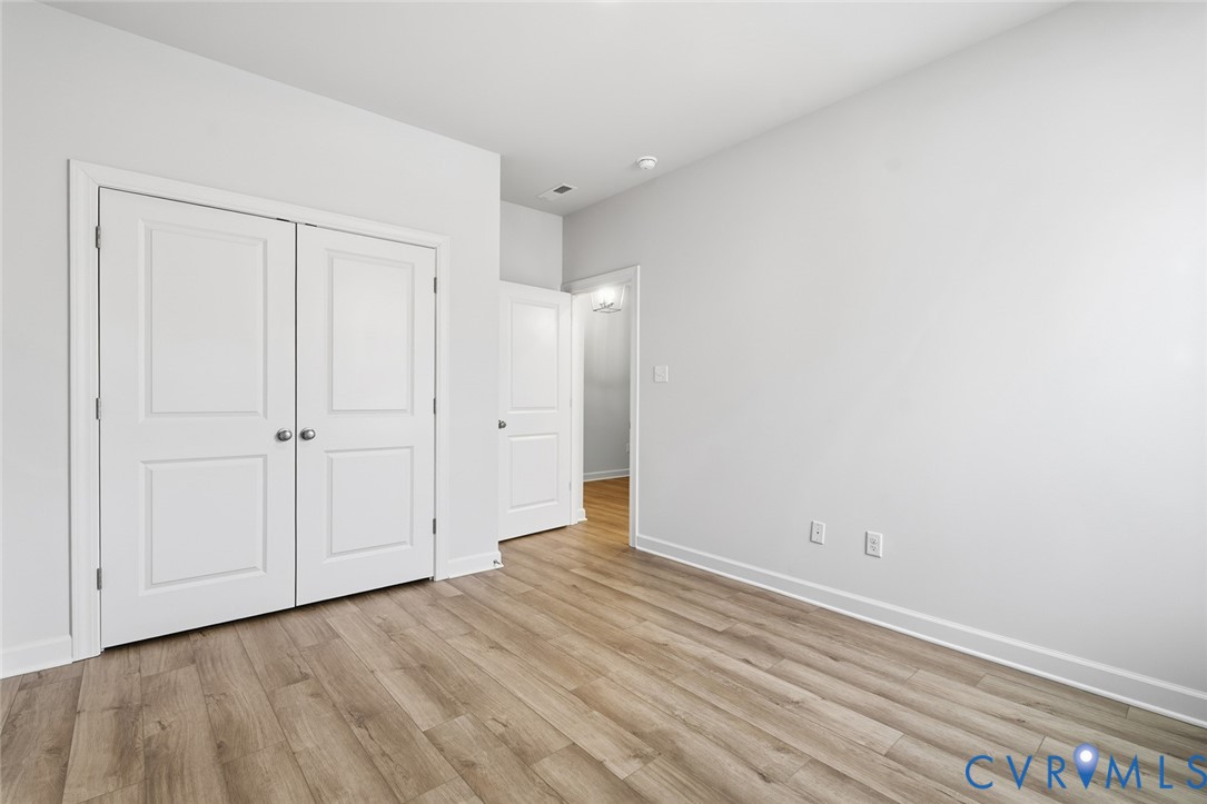 19018 Palisades Ridge Moseley, VA 23120 - Photo 14 of 37 a view of an empty room with wooden floor