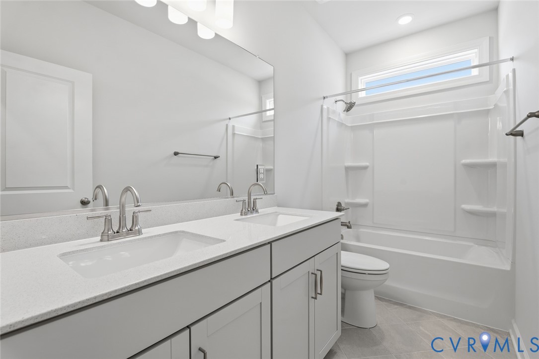 19018 Palisades Ridge Moseley, VA 23120 - Photo 19 of 37 a bathroom with a bathtub shower sink vanity mirror and toilet