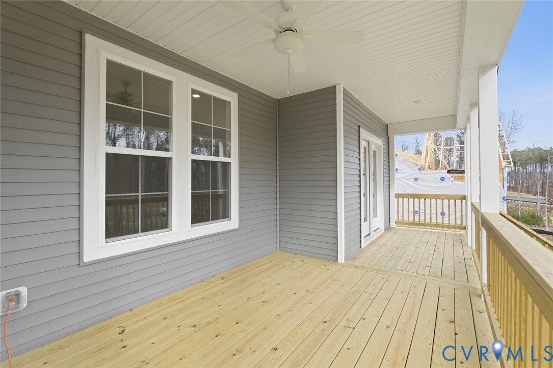 19018 Palisades Ridge Moseley, VA 23120 - Photo 20 of 37 a view of a balcony with wooden floor and fence