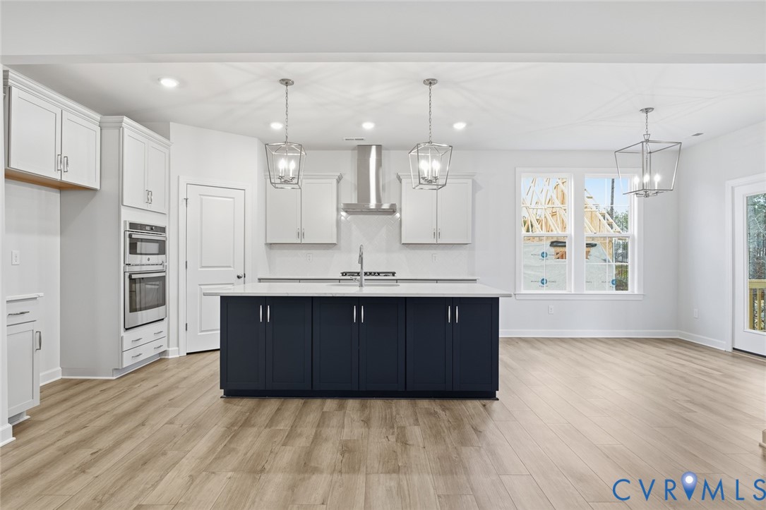 19018 Palisades Ridge Moseley, VA 23120 - Photo 5 of 37 a large kitchen with a large counter top appliances and cabinets