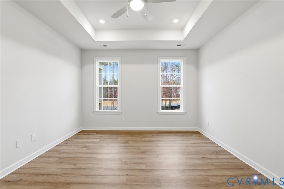 19018 Palisades Ridge Moseley, VA 23120 - Photo 10 of 37 an empty room with wooden floor and windows