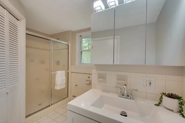 a bathroom with a sink and a shower