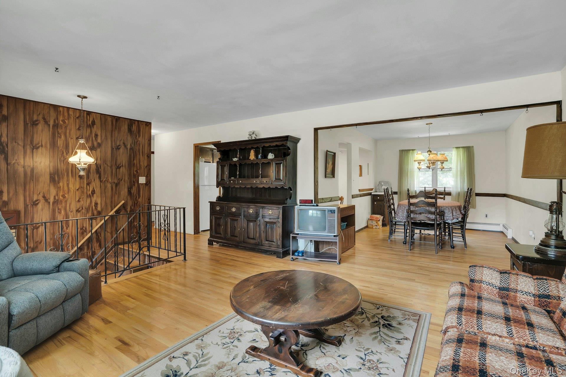 111 Daly Road East Northport, NY 11731 - Photo 8 of 38 Living Room flows into Dining Room