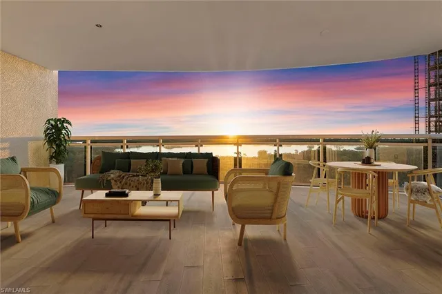 a terrace with outdoor seating and city view