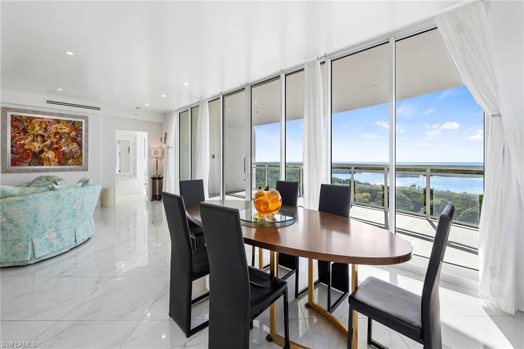 13945 Old Coast Road, Unit 806 Naples, FL 34110 - Photo 11 of 50 a dining room with furniture and window
