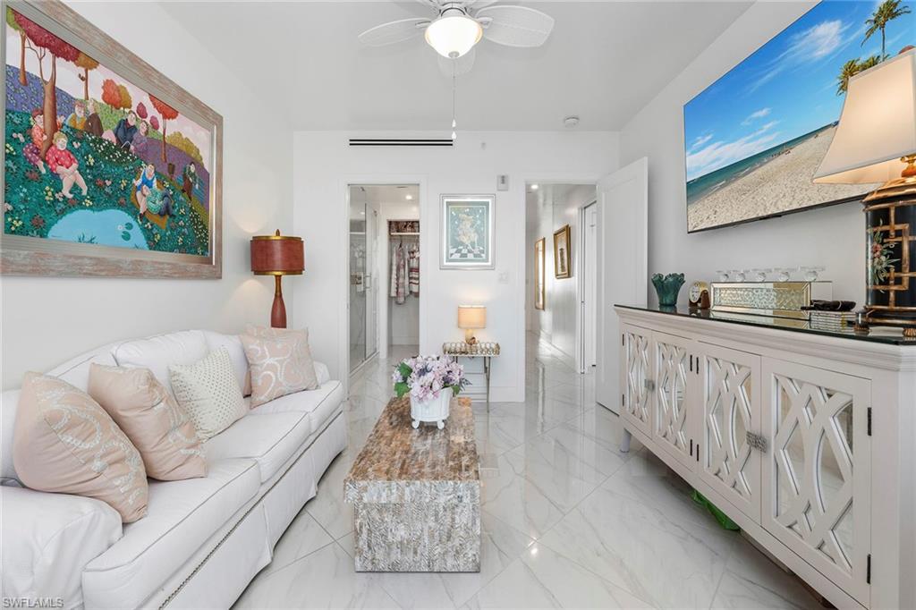 13945 Old Coast Road, Unit 806 Naples, FL 34110 - Photo 24 of 50 a living room with furniture and painting on the wall