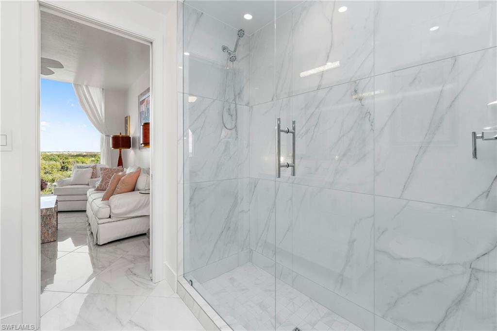 13945 Old Coast Road, Unit 806 Naples, FL 34110 - Photo 26 of 50 a en suite bathroom with a shower