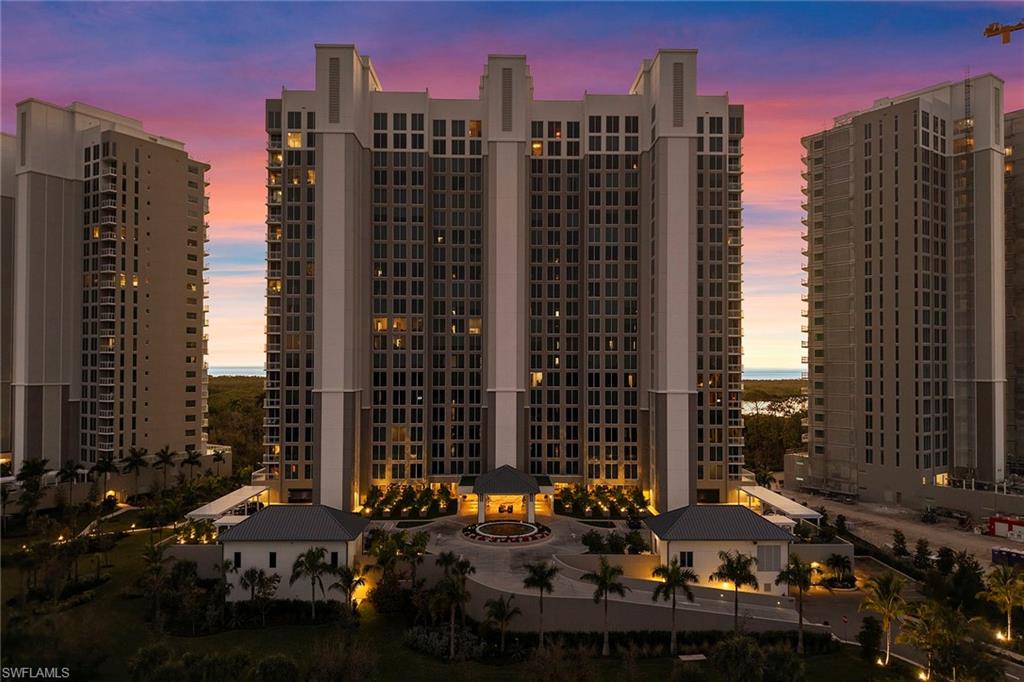 13945 Old Coast Road, Unit 806 Naples, FL 34110 - Photo 33 of 50 a city street filled with lots of tall buildings