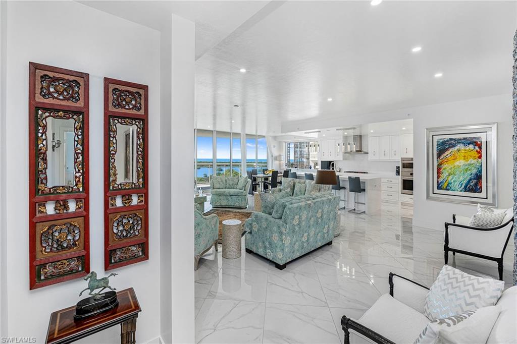 13945 Old Coast Road, Unit 806 Naples, FL 34110 - Photo 4 of 50 a living room with furniture and painting on the wall