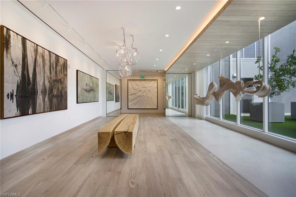 13945 Old Coast Road, Unit 806 Naples, FL 34110 - Photo 41 of 50 a view of a livingroom with furniture and staircase