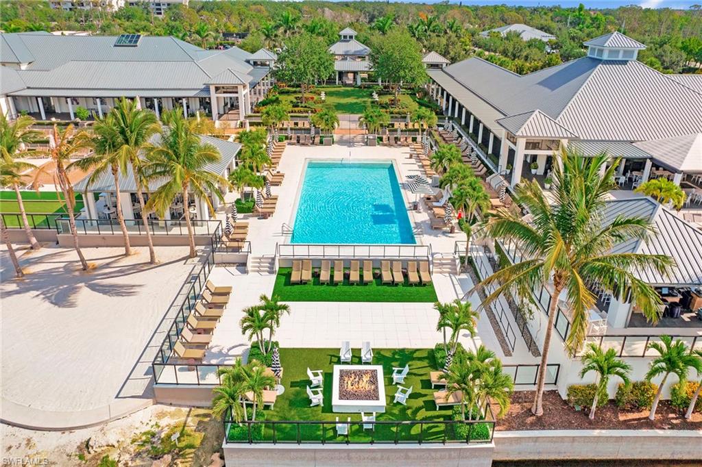 13945 Old Coast Road, Unit 806 Naples, FL 34110 - Photo 43 of 50 an aerial view of residential houses with yard and swimming pool