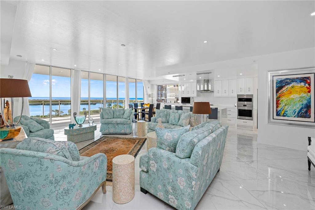 13945 Old Coast Road, Unit 806 Naples, FL 34110 - Photo 7 of 50 a living room with furniture and a view of kitchen