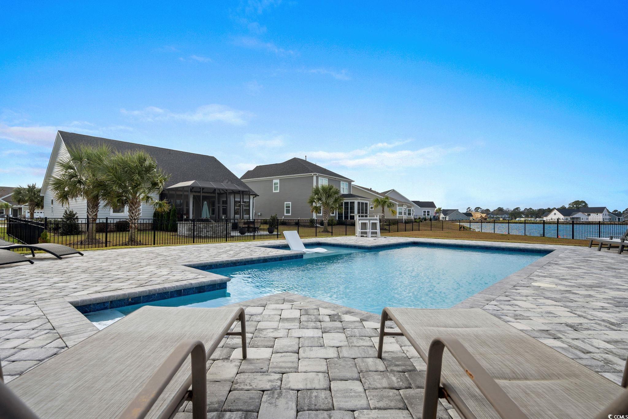 506 Indigo Bay Circle Myrtle Beach, SC 29579 - Photo 20 of 40 View of pool featuring a patio area and a residential view