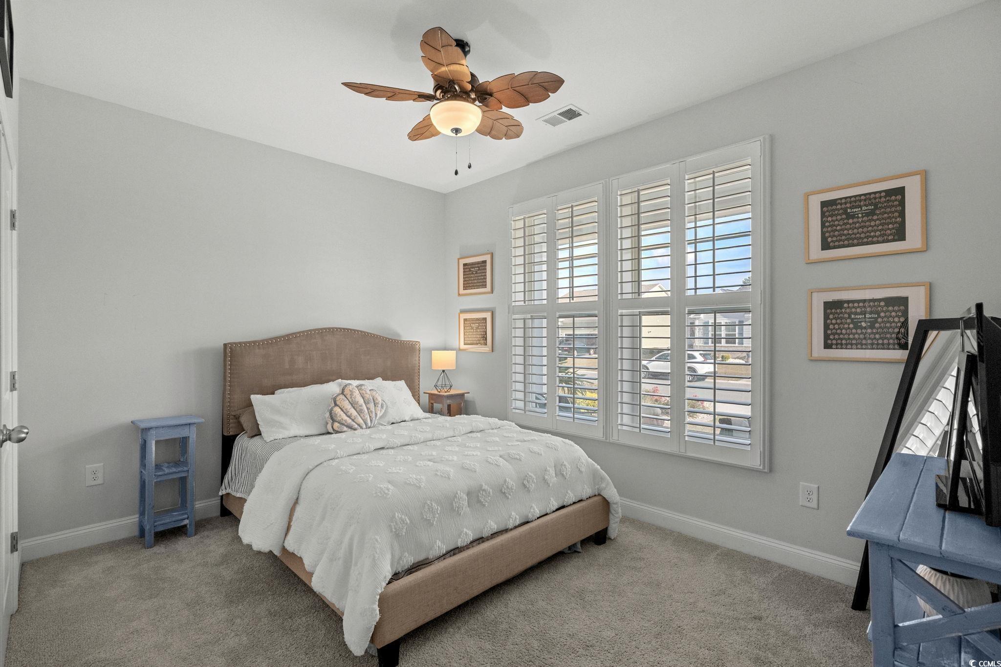 506 Indigo Bay Circle Myrtle Beach, SC 29579 - Photo 27 of 40 Bedroom with a ceiling fan and carpet flooring