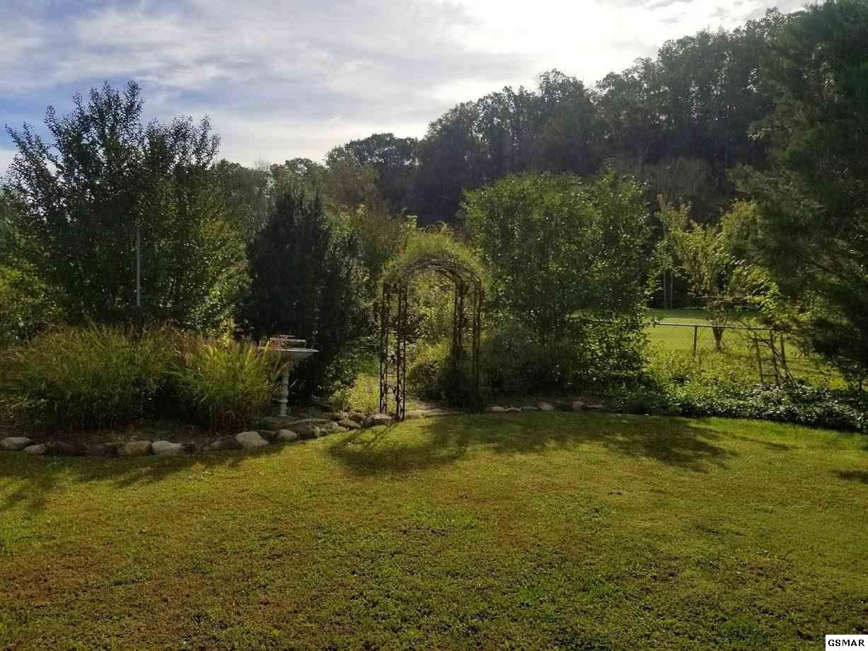 1822 New Era Road Sevierville, TN 37862 - Photo 24 of 34 a view of a lake with a yard