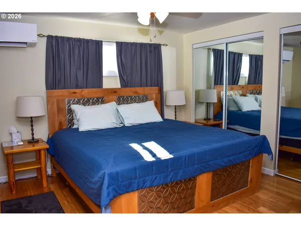 a bedroom with a bed and a table