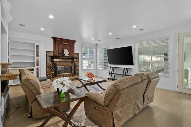 a living room with a bed furniture and a window