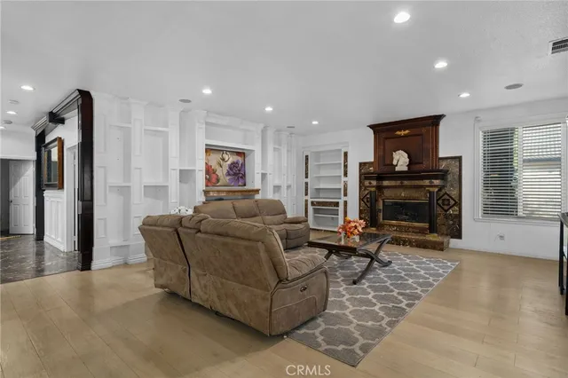 a spacious bedroom with a bed and a fireplace