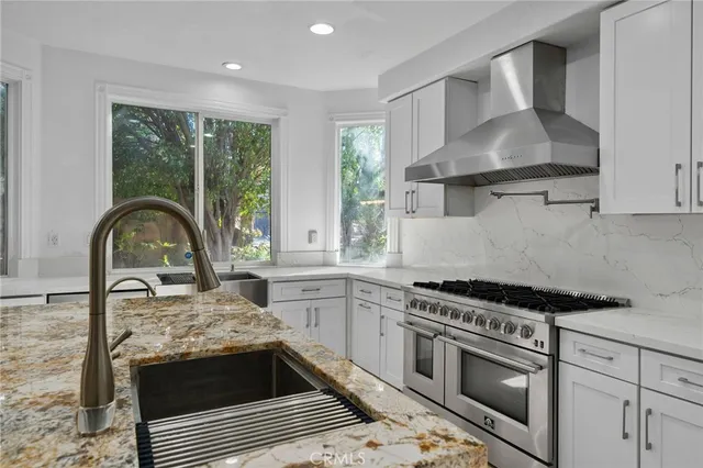 a view of an outdoor sitting area with furniture