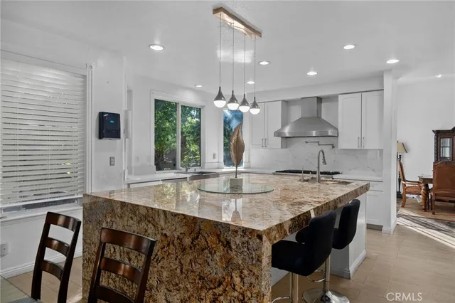 a kitchen with kitchen island granite countertop lots of counter top space