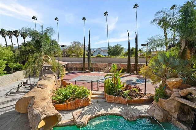 an aerial view of a house with garden space and street view