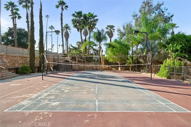a view of a patio with table and chairs and potted plants