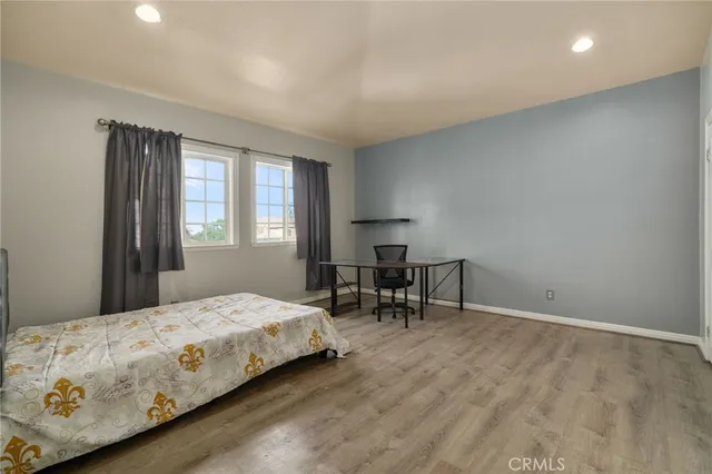 a view of a patio with couches and potted plants