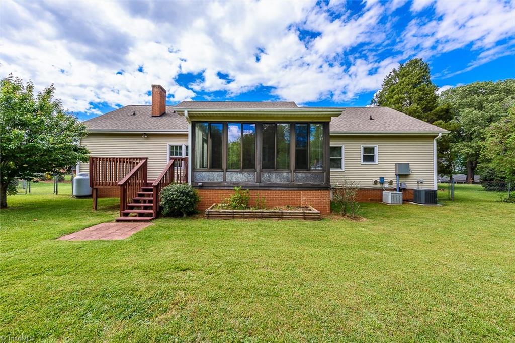 128 Raintree Road Advance, NC 27006 - Photo 3 of 29 Back Yard / Deck / Sunporch / Fenced