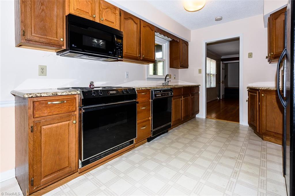 128 Raintree Road Advance, NC 27006 - Photo 5 of 29 Galley Kitchen