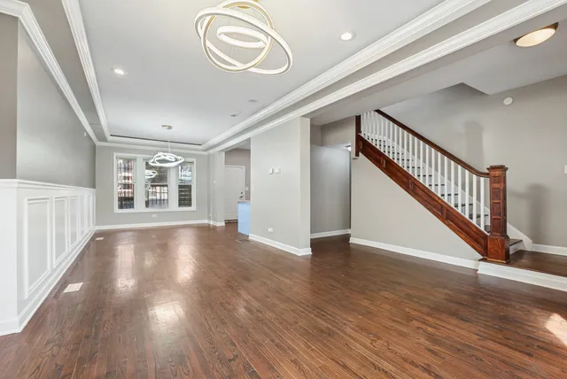 a view of an entryway with wooden floor