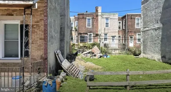 a balcony with table and chairs