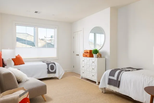 a bedroom with furniture and a window