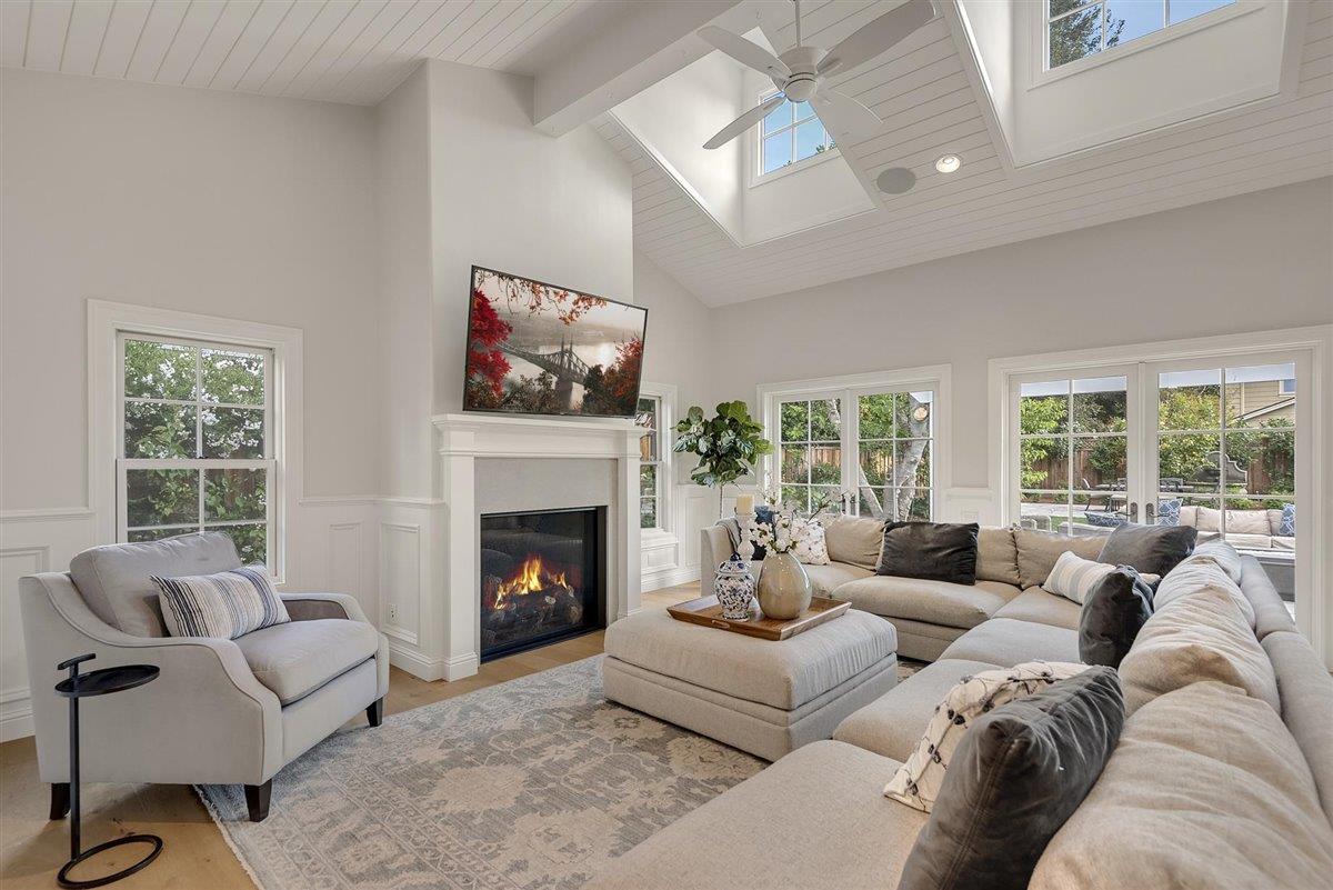 593 Sleeper Avenue Mountain View, CA 94040 - Photo 12 of 56 a living room with furniture fireplace and a large window