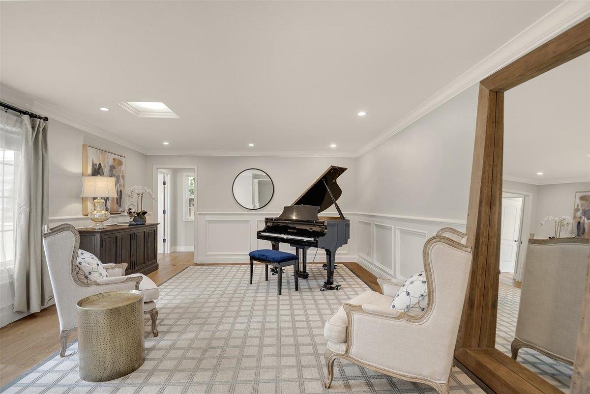 593 Sleeper Avenue Mountain View, CA 94040 - Photo 16 of 56 a living room with furniture a rug and white walls