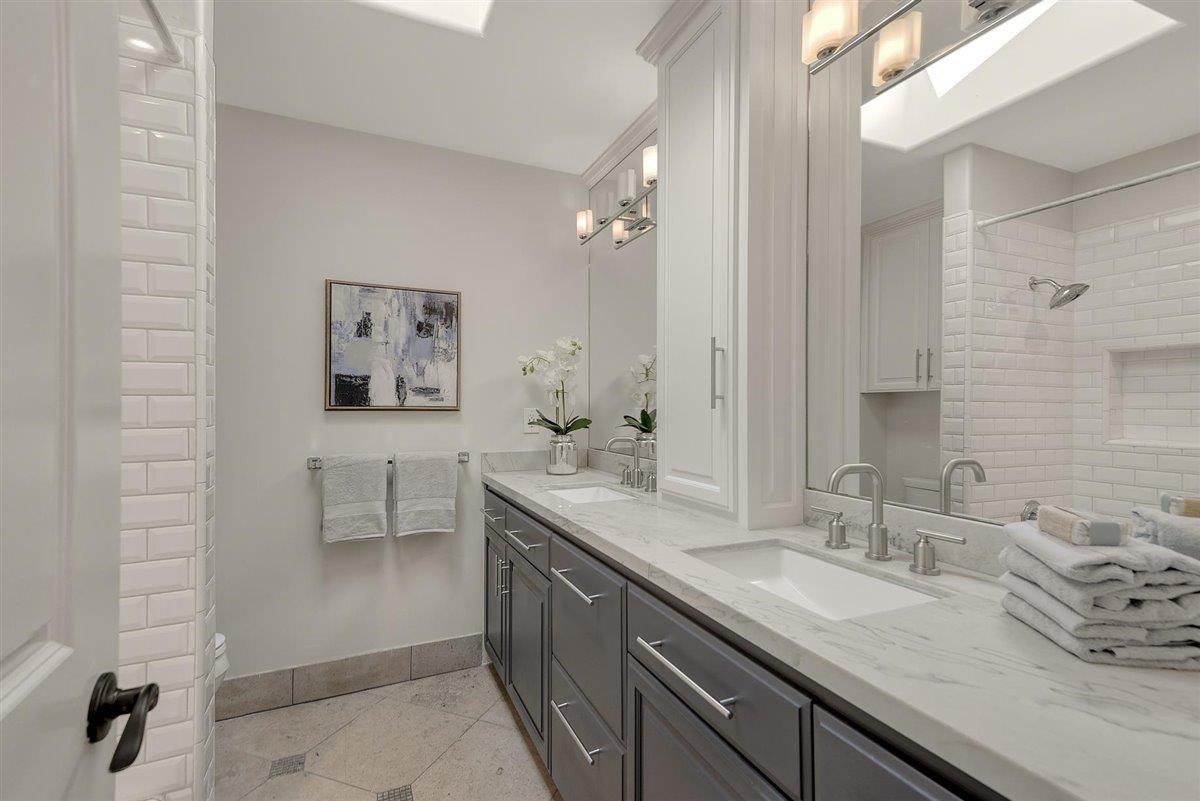 593 Sleeper Avenue Mountain View, CA 94040 - Photo 33 of 56 a spacious bathroom with a granite countertop sink a toilet and a mirror