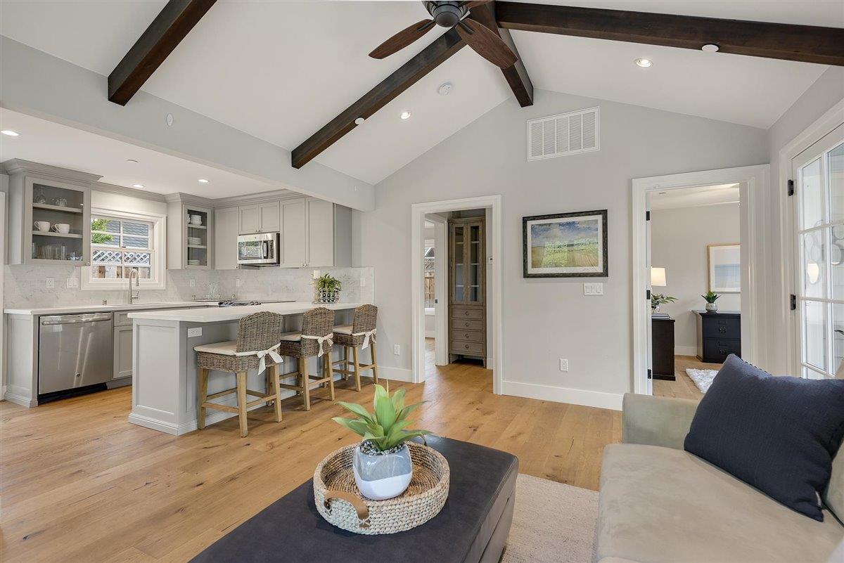 593 Sleeper Avenue Mountain View, CA 94040 - Photo 45 of 56 a living room with furniture kitchen view and a wooden floor