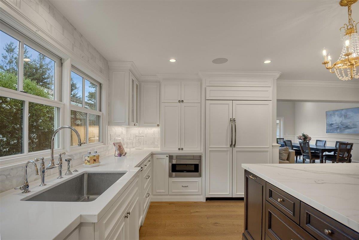 593 Sleeper Avenue Mountain View, CA 94040 - Photo 8 of 56 a kitchen with refrigerator cabinets and large counter space