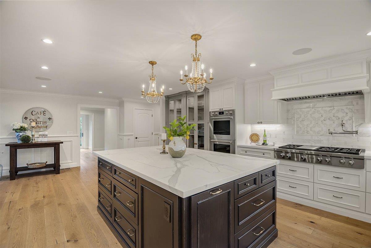 593 Sleeper Avenue Mountain View, CA 94040 - Photo 9 of 56 a kitchen that has a lot of cabinets in it