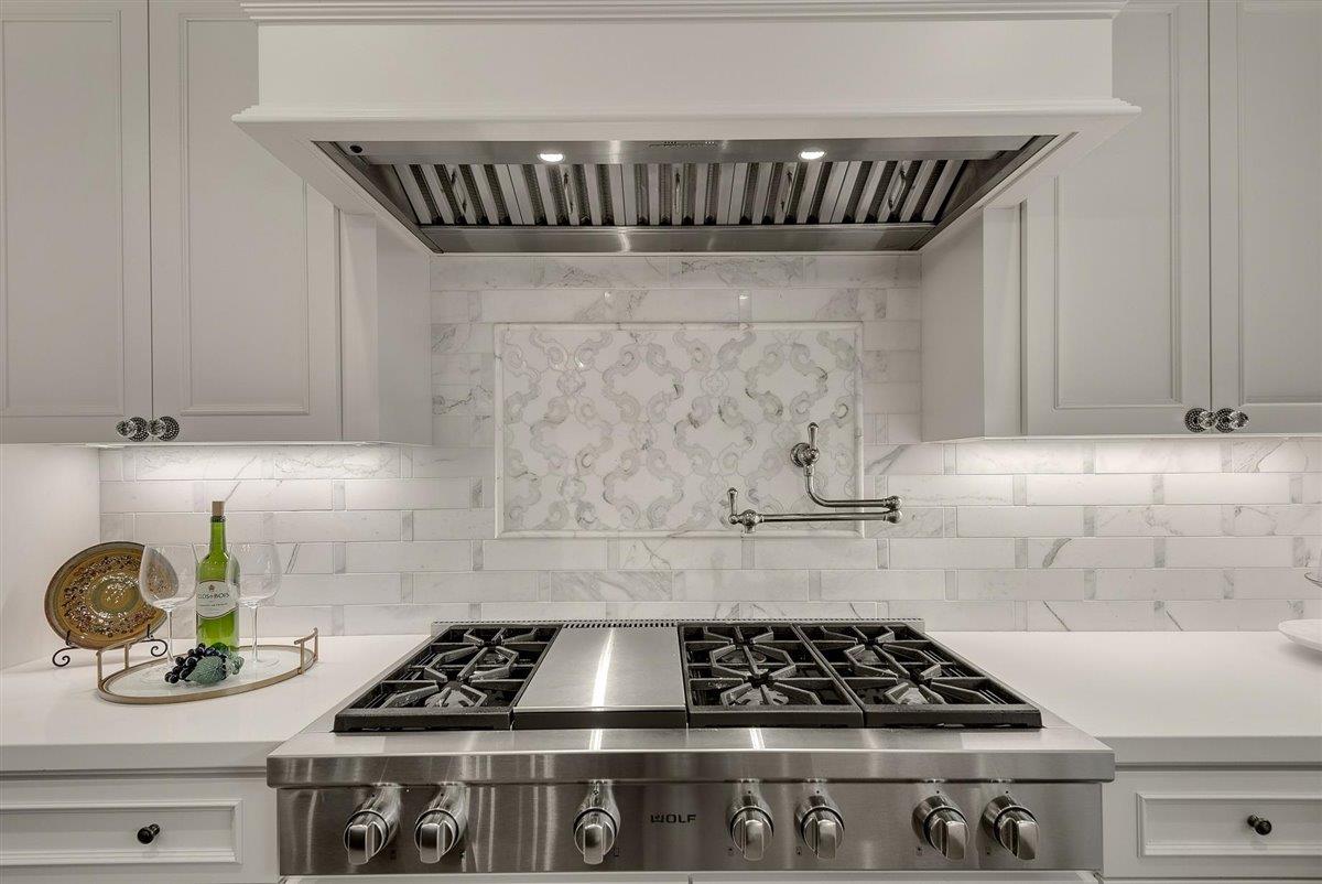 593 Sleeper Avenue Mountain View, CA 94040 - Photo 10 of 56 a kitchen with a stove and cabinets
