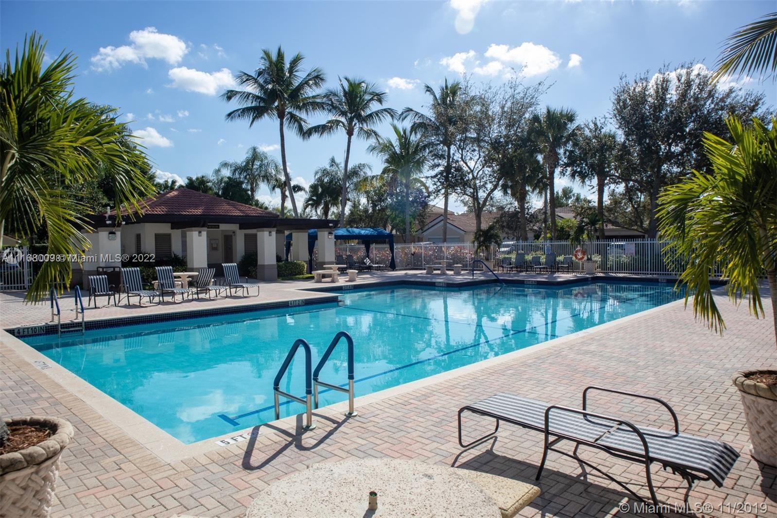 Weston Weston, FL 33326 - Photo 18 of 25 a swimming pool with outdoor seating and yard