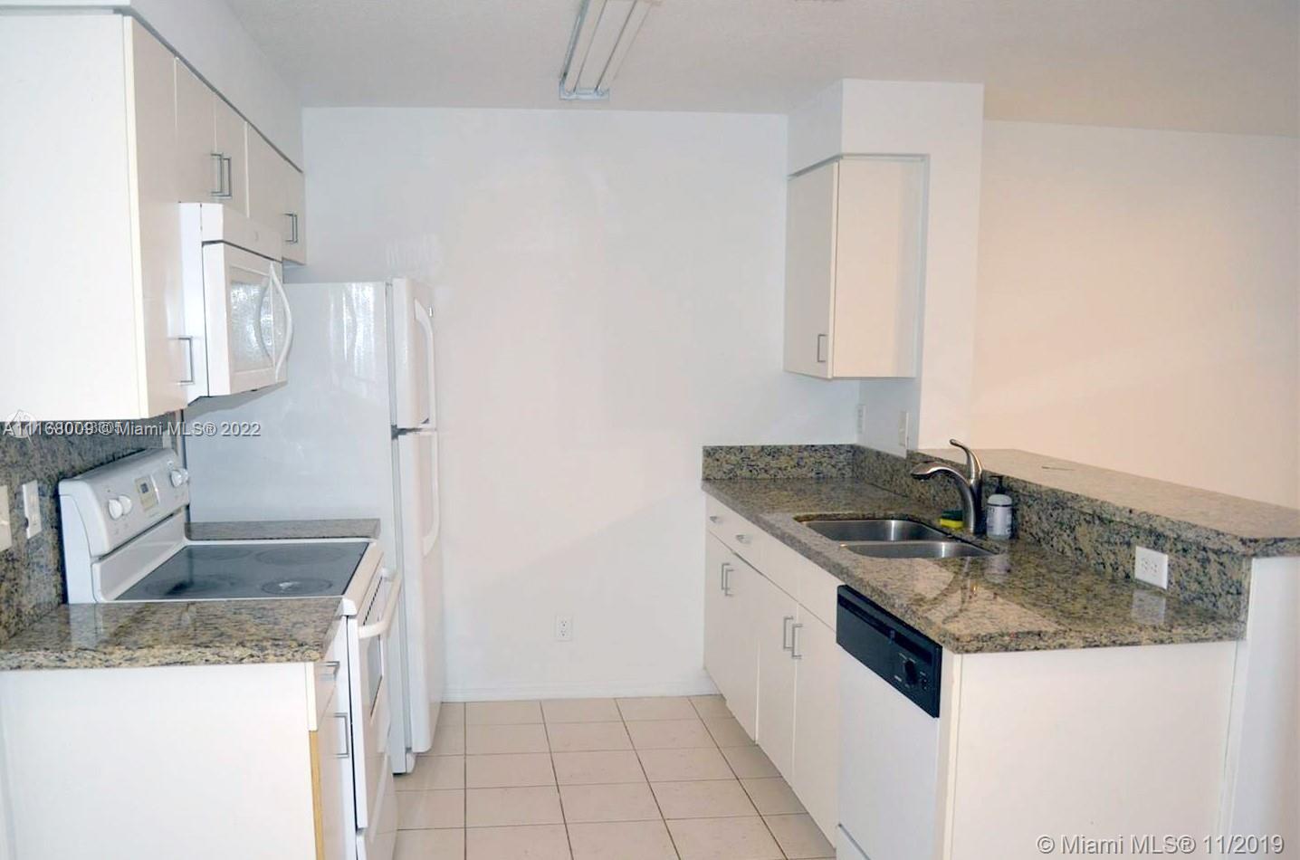 Weston Weston, FL 33326 - Photo 2 of 25 a kitchen with granite countertop a sink stove and refrigerator