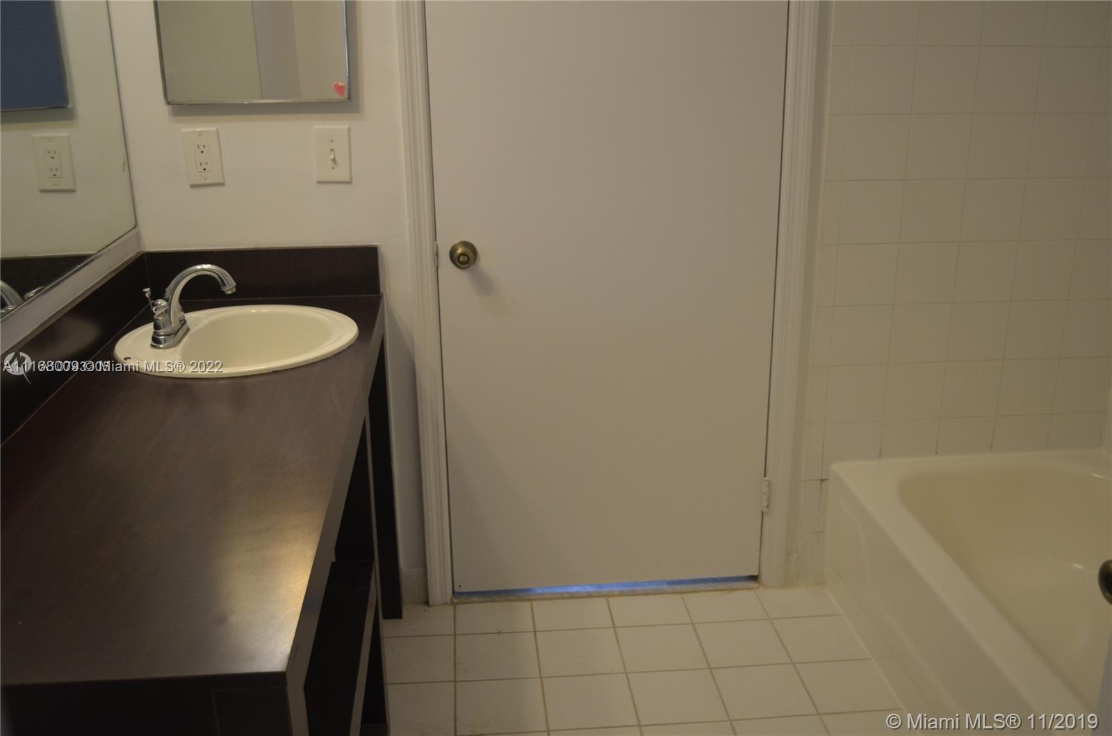 Weston Weston, FL 33326 - Photo 9 of 25 a bathroom with a sink and a tub