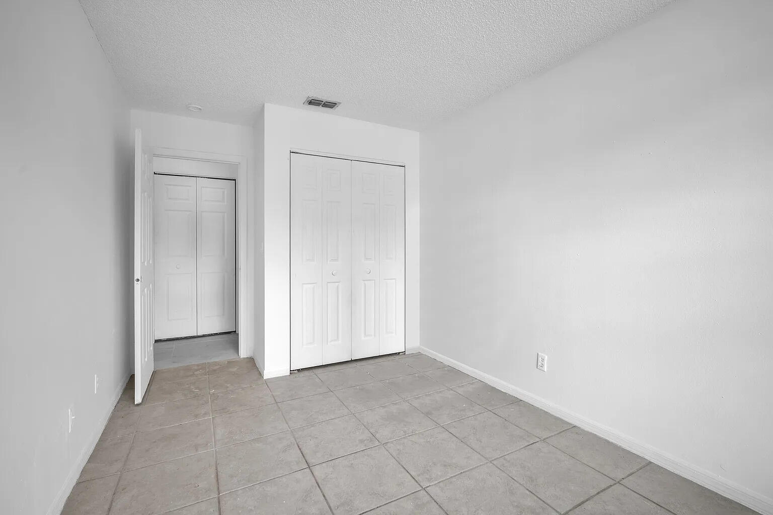 719 Southwest 10th Street Florida City, FL 33034 - Photo 7 of 13 an empty room with closet