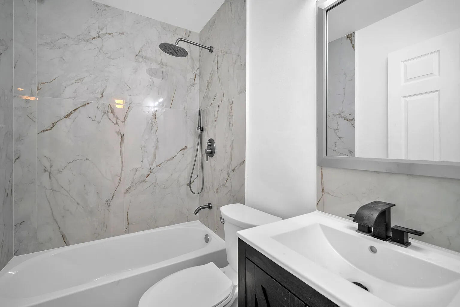 719 Southwest 10th Street Florida City, FL 33034 - Photo 8 of 13 a bathroom with a sink a toilet and a bathtub