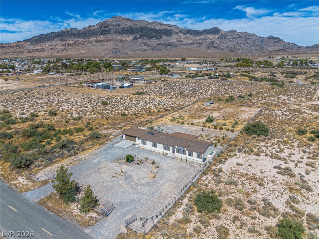 2380 West Simkins Road Pahrump, NV 89060 - Photo 34 of 38 A spacious desert property enjoys sweeping views of the rugged mountain landscape.