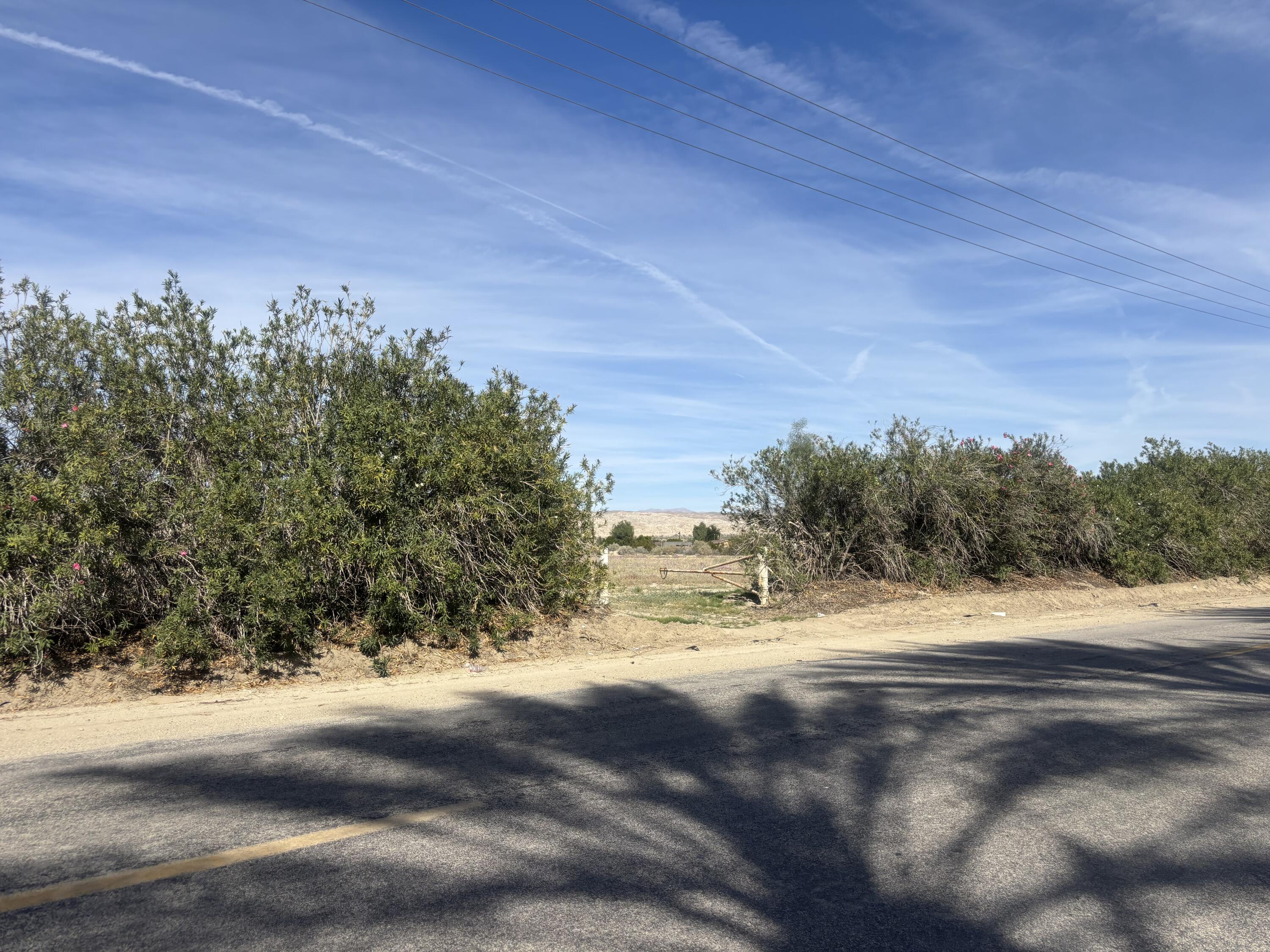 0 70th Avenue Mecca, CA 92254 - Photo 1 of 3 a view of dirt field with trees around
